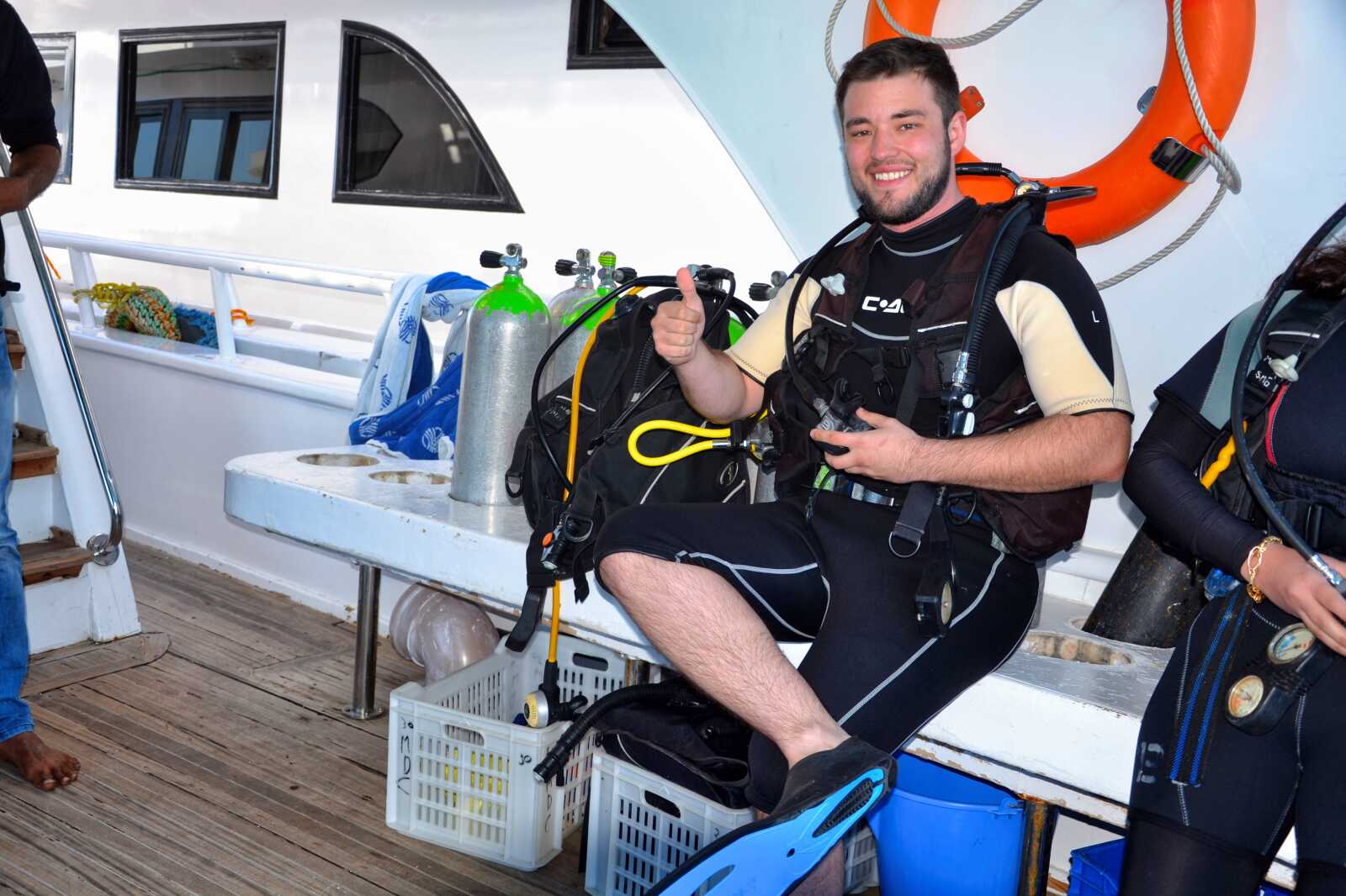 A scuba diver preparing their gear for the next dive, one of the best things to do in Sharm El-Sheikh.