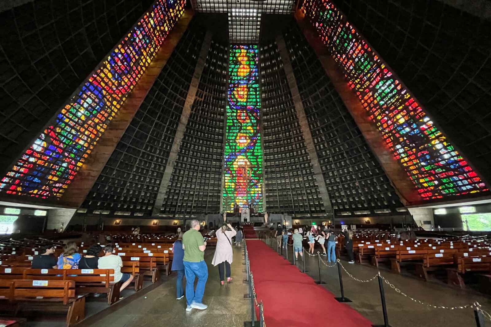 People admiring the inside of the Cathedral of Saint Sebastian in Rio de Janeiro.