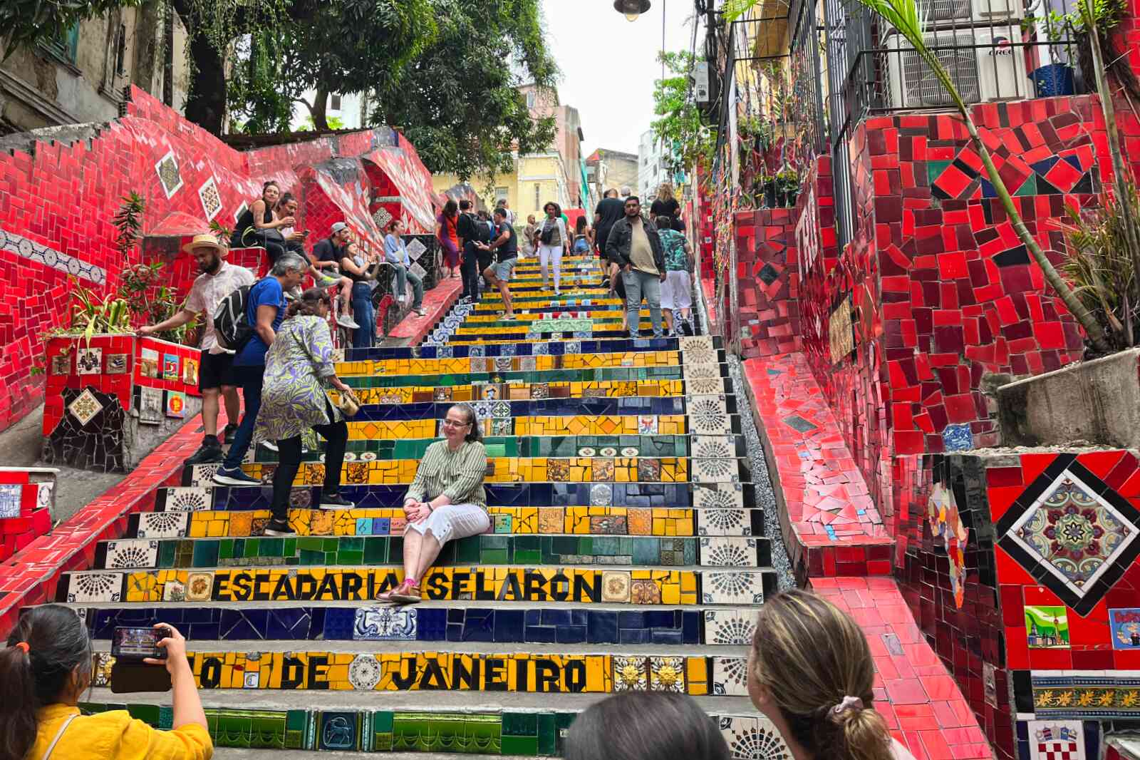 People walking the selaron steps in Lapa, Rio de Janeiro.