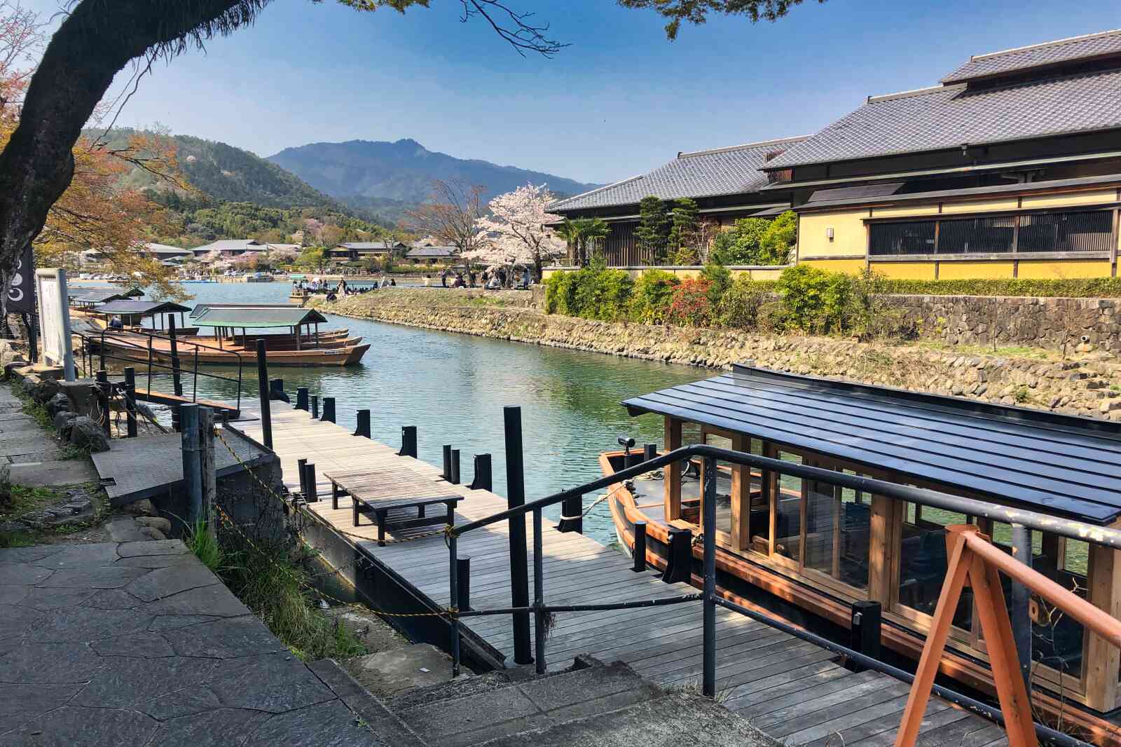 Boats sit calmly at the docks in Arashiyama on the Katsura River.