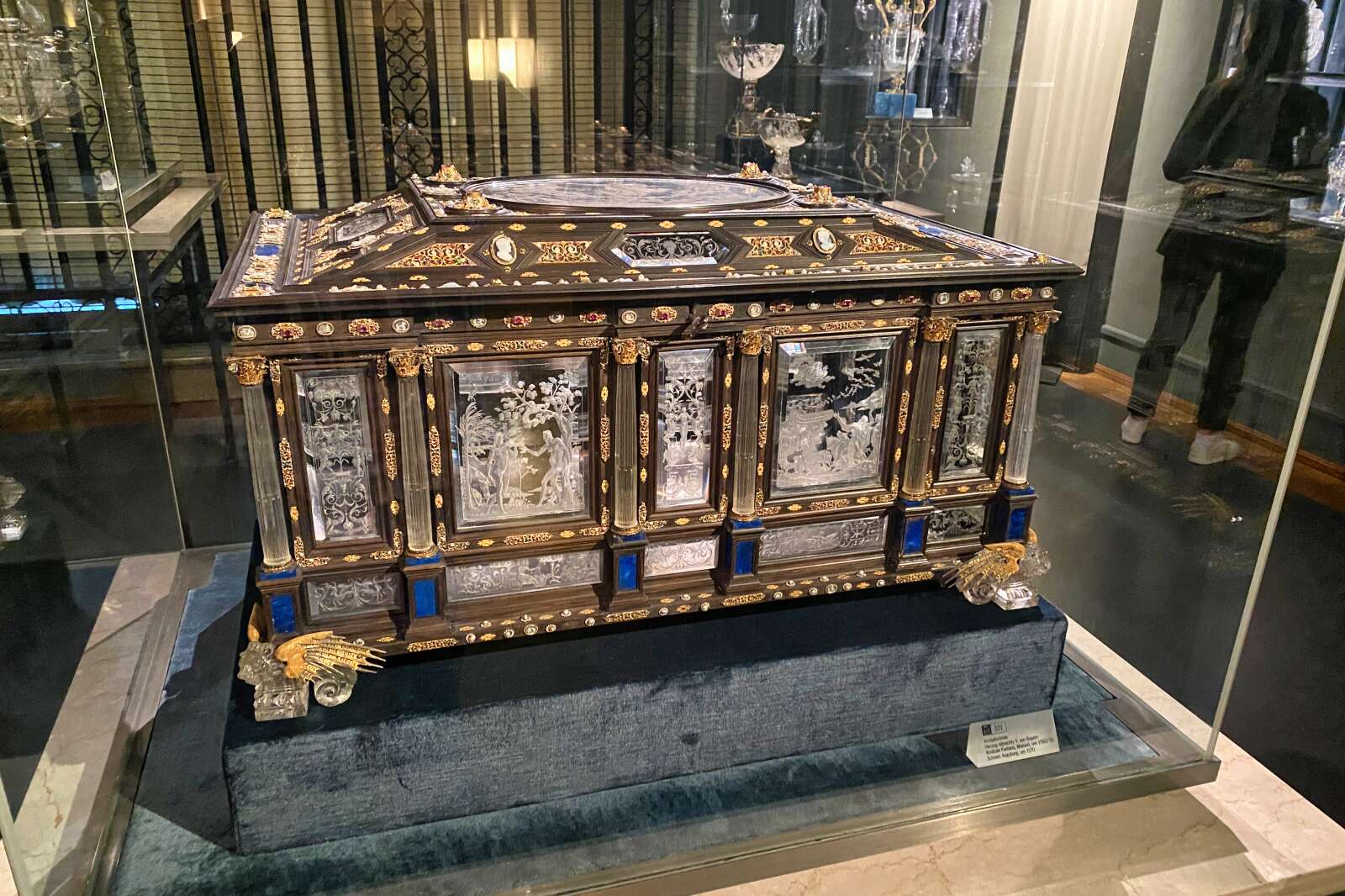 An ornately decorated chest in the Nymphenburg Palace exhibits.