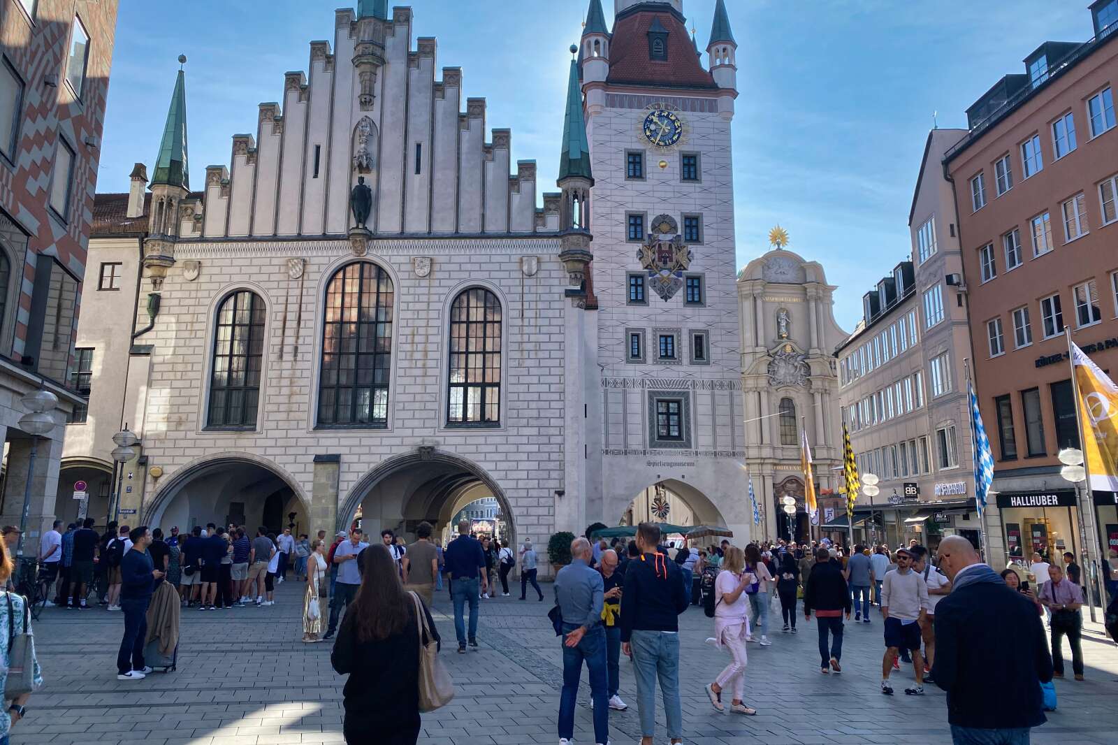 People in Munich, Germany walking past Marienplatz.