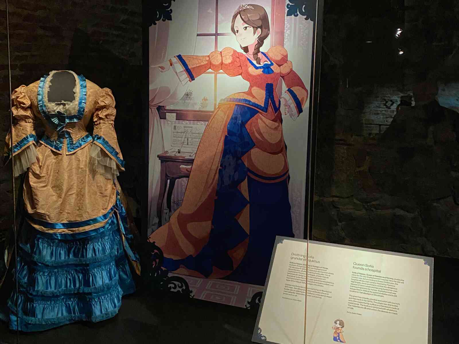 Princess Sofia's dress and anime-style photo in the Royal Armory exhibits in Stockholm.