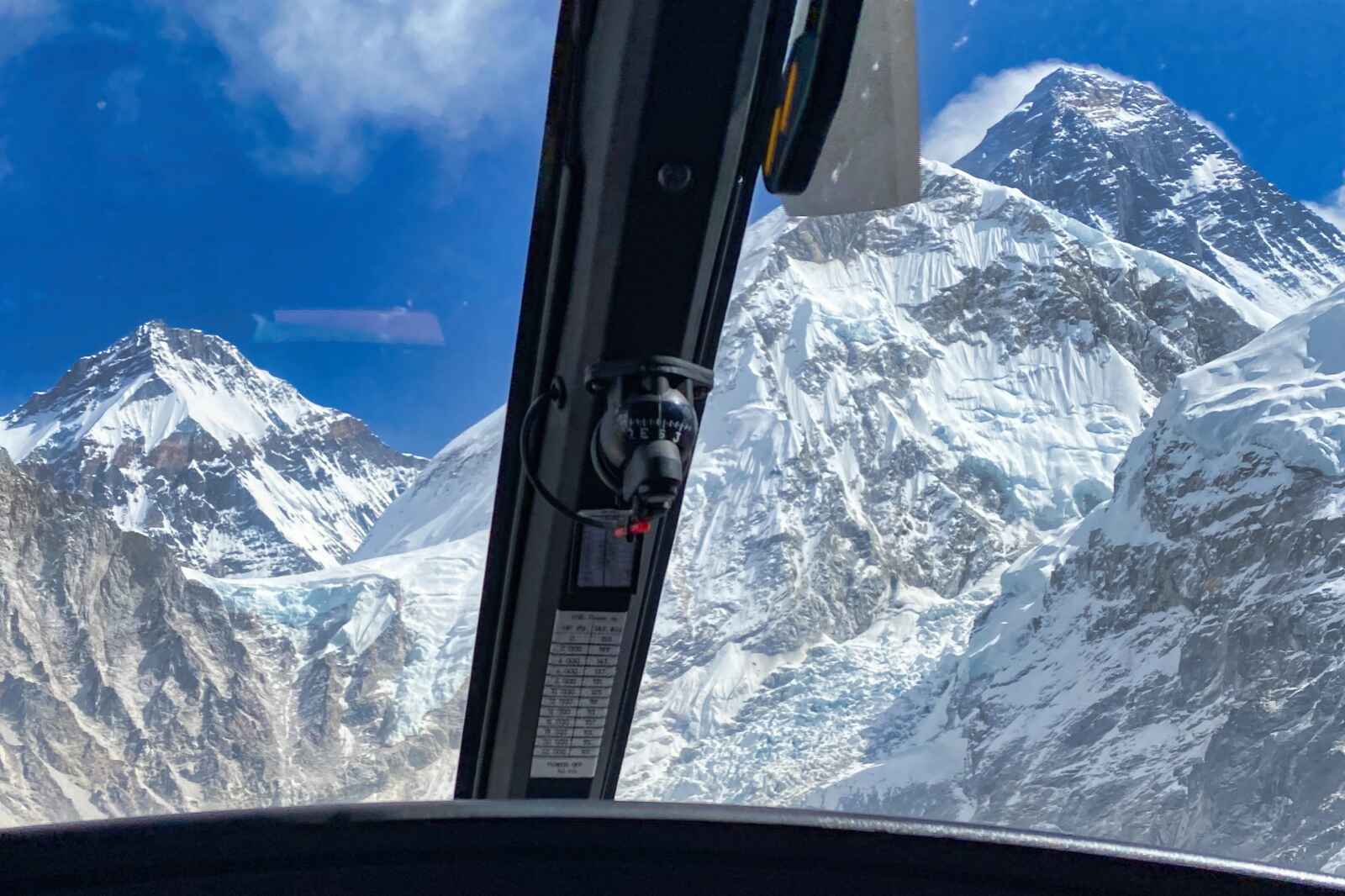 A view of Mt. Everest from the cockpit of a mt everest helicopter tour.