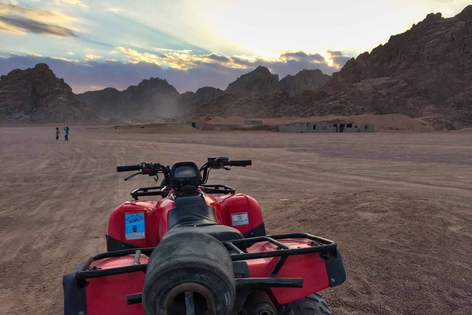 An ATV waits in the desert by the Sharm El-Sheikh mountains in Egypt.