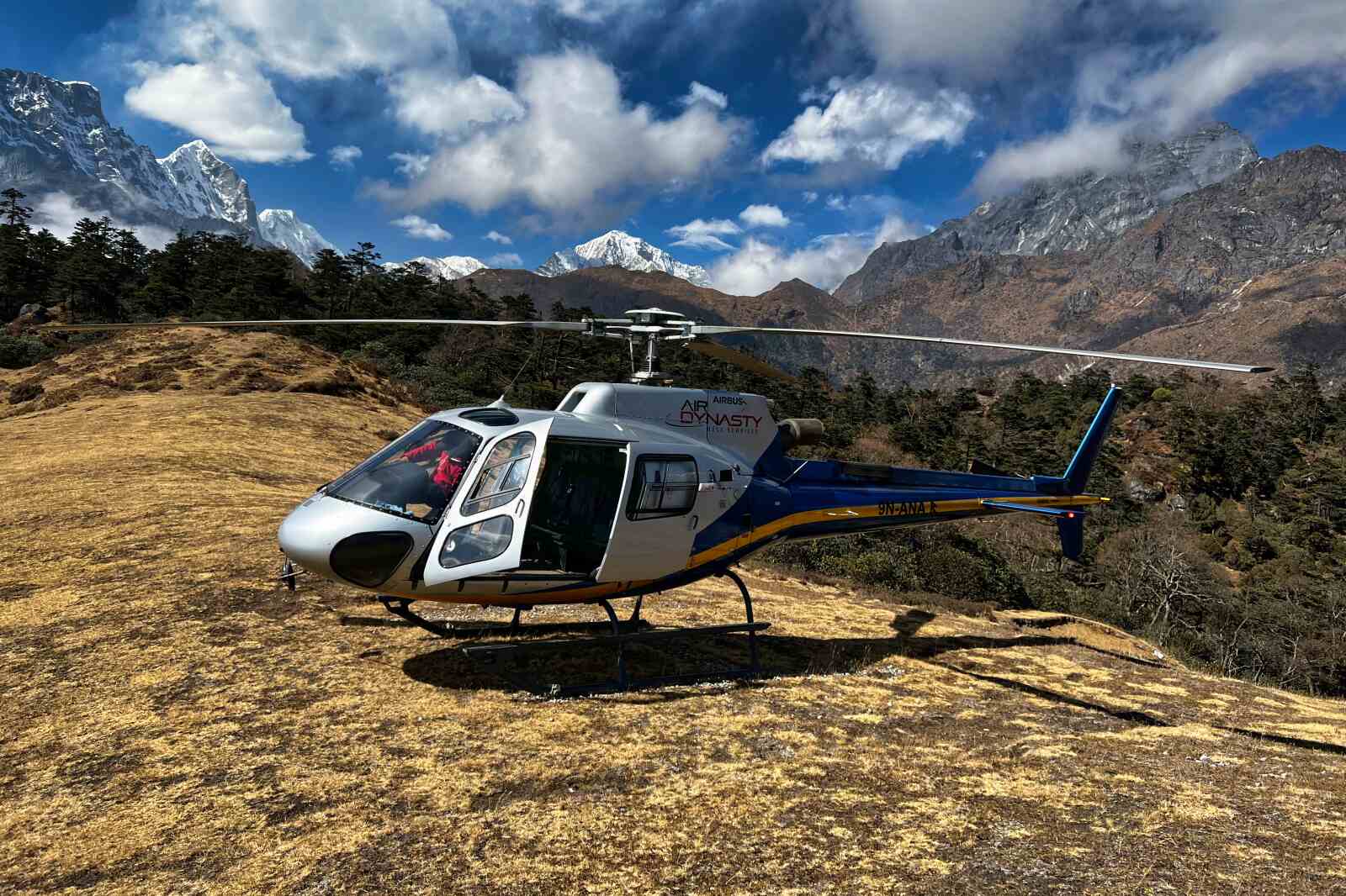 A pilot preparing a helicopter for boarding on Syangboche Hill in Nepal.