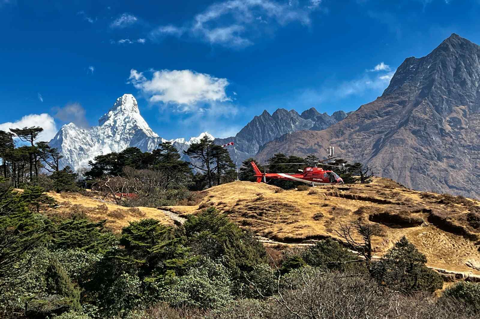 A helicopter awaits passengers on Syangboche Hill in Nepal.